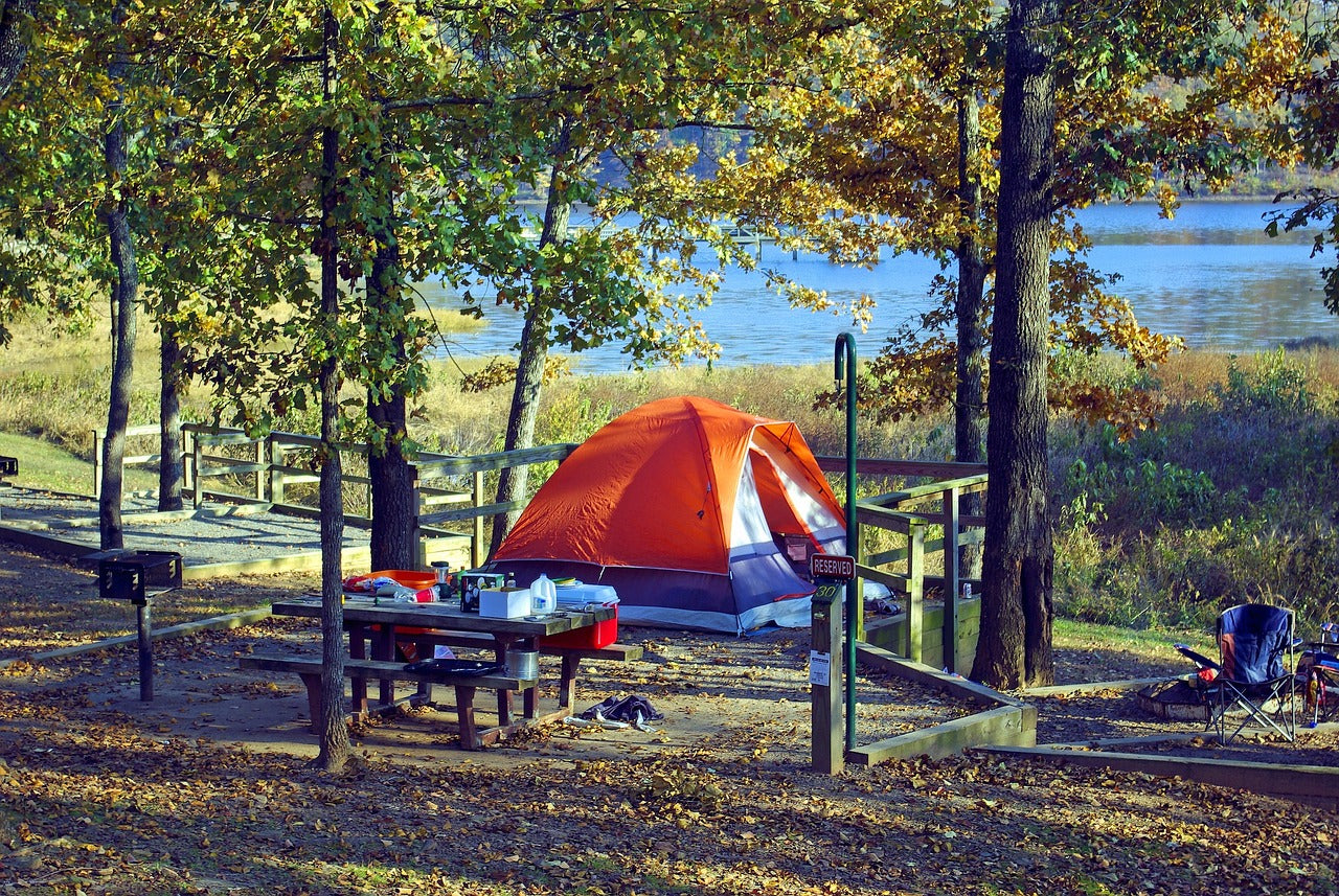 Tent camp by lake Image by Mike Goad from Pixabay